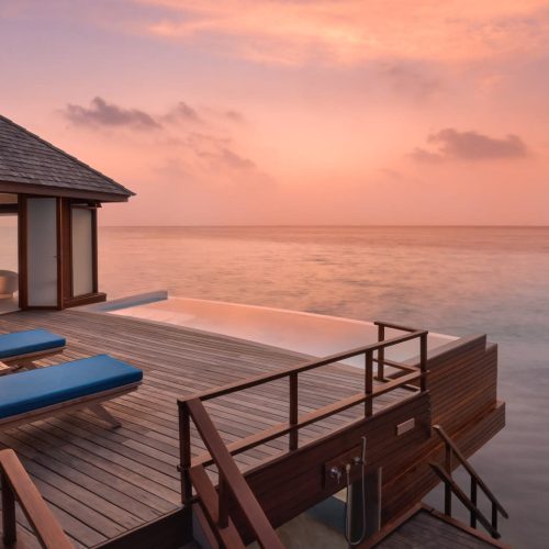 13-anantaradhigumaldivesresortguestroomoverwaterpoolsuitedecksunset1920x1037